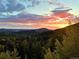 Spectacular sunset over mountain ridges, visible from home at 10518 Christopher Dr, Conifer, CO 80433