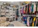 Large walk-in closet with ample shelving and hanging space at 10518 Christopher Dr, Conifer, CO 80433