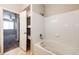 Bathroom with tub, built-in shelves and bedroom view at 5255 Memphis St # 917, Denver, CO 80239