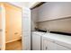 Laundry room with washer, dryer, and extra storage at 5255 Memphis St # 917, Denver, CO 80239