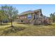 Spacious backyard featuring a well-maintained lawn and a raised deck for outdoor living at 6642 S Routt St, Littleton, CO 80127