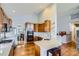 Bright kitchen with ample counter space, stainless appliances, and breakfast bar seating at 6642 S Routt St, Littleton, CO 80127