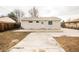 A backyard featuring a concrete patio, manicured lawn, and privacy fence, ideal for outdoor enjoyment at 8511 Cherry Ln, Westminster, CO 80031