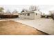 A private backyard featuring a large concrete patio and grassy area, perfect for outdoor living and recreation at 8511 Cherry Ln, Westminster, CO 80031