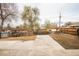 A large backyard with a patio area and mature trees, offering ample space for outdoor activities and entertaining at 8511 Cherry Ln, Westminster, CO 80031