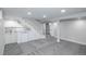 Finished basement area with stairs, wet bar, cabinetry, and carpeted flooring at 8511 Cherry Ln, Westminster, CO 80031