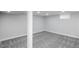 Finished basement space with neutral carpet, recessed lighting, and natural light at 8511 Cherry Ln, Westminster, CO 80031