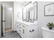 Modern bathroom featuring double vanity sinks, framed mirrors, and stylish fixtures at 8511 Cherry Ln, Westminster, CO 80031