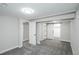 A bedroom with gray carpet, white trim and white walls with open doors and closets and recessed lighting at 8511 Cherry Ln, Westminster, CO 80031