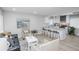Bright living room open to the kitchen, with modern decor, stylish seating, and natural light at 8511 Cherry Ln, Westminster, CO 80031
