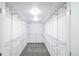 Spacious walk-in closet with metal shelving and neutral colored carpet at 8511 Cherry Ln, Westminster, CO 80031