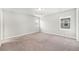 Spacious bedroom with neutral carpet, baseboard, and dual windows that add natural light at 3332 Valentia St, Denver, CO 80238