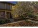Inviting exterior with well-manicured landscaping and mature flowering trees enhance curb appeal at 3332 Valentia St, Denver, CO 80238