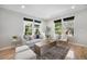 Bright living room filled with natural light, stylish furniture, and hardwood floors at 3332 Valentia St, Denver, CO 80238