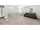Bright loft with a couch and windows providing natural light at 3332 Valentia St, Denver, CO 80238