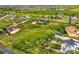 Gorgeous aerial view of a sprawling lot with mature trees, shrubs and a neighboring property at 41975 Muirfield Loop, Elizabeth, CO 80107