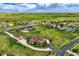 Gorgeous aerial view of a sprawling community with mature landscaping and rolling hills at 41975 Muirfield Loop, Elizabeth, CO 80107
