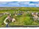 Aerial view of a large lot with mature trees with adjacent properties nearby at 41975 Muirfield Loop, Elizabeth, CO 80107