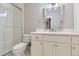 Bright bathroom featuring white vanity, shower with glass door, and stylish finishes at 41975 Muirfield Loop, Elizabeth, CO 80107