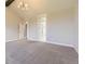 Spacious bedroom with neutral carpet, vaulted ceilings and an ensuite bath at 41975 Muirfield Loop, Elizabeth, CO 80107