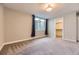 Basement bedroom with carpet flooring, a closet, and an egress window with backyard views at 41975 Muirfield Loop, Elizabeth, CO 80107