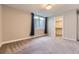 Bedroom featuring a walk-in closet, neutral walls, and plush carpet at 41975 Muirfield Loop, Elizabeth, CO 80107