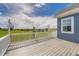 Spacious deck with white railings offering serene views of the surrounding landscape at 41975 Muirfield Loop, Elizabeth, CO 80107