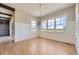 Bright dining room with hardwood floors, wainscoting, and modern chandelier at 41975 Muirfield Loop, Elizabeth, CO 80107