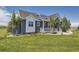 Charming two-story home featuring a well-manicured lawn and beautiful landscaping at 41975 Muirfield Loop, Elizabeth, CO 80107