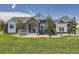 Charming home featuring a stone-accented entrance, well-manicured lawn, and blue and white color scheme at 41975 Muirfield Loop, Elizabeth, CO 80107