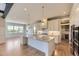 Bright and spacious kitchen featuring a central island and hardwood floors at 41975 Muirfield Loop, Elizabeth, CO 80107