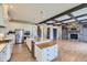 Spacious kitchen with stainless steel appliances, granite countertops and a large central island at 41975 Muirfield Loop, Elizabeth, CO 80107