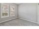 Cozy bedroom with large windows and neutral carpeting at 5895 S Taft Ct # H, Littleton, CO 80127