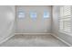 Bright, empty bedroom space offering a clean design with natural light at 5895 S Taft Ct # H, Littleton, CO 80127