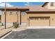 Exterior view of the home, showcasing the two-car garage and a low-maintenance yard at 5895 S Taft Ct # H, Littleton, CO 80127