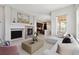 Bright living room featuring a fireplace, modern decor, and an open floor plan at 5895 S Taft Ct # H, Littleton, CO 80127