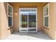 Covered outdoor patio with a sliding glass door, providing seamless indoor-outdoor living at 5895 S Taft Ct # H, Littleton, CO 80127