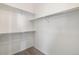 Spacious walk-in closet equipped with shelving for efficient storage and organization at 5895 S Taft Ct # H, Littleton, CO 80127