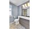Modern bathroom featuring a sleek vanity with drawers, a mirror with lighting, and a convenient toilet at 7877 S Ulster St, Centennial, CO 80112