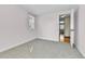 Bright bedroom with a neutral color palette, carpet, and window providing natural light at 7877 S Ulster St, Centennial, CO 80112
