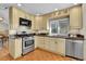 Well-equipped kitchen featuring stainless steel appliances and ample cabinet space at 7877 S Ulster St, Centennial, CO 80112