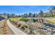 Tranquil community with lush landscaping, walking path, and tennis courts at 7877 S Ulster St, Centennial, CO 80112