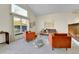 Spacious living room features vaulted ceilings, large windows, modern decor, and comfortable seating at 7877 S Ulster St, Centennial, CO 80112