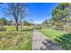 Picturesque walking path surrounded by lush greenery and mature trees at 7877 S Ulster St, Centennial, CO 80112