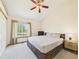 Cozy bedroom featuring natural light, a large window with view, and neutral decor for relaxation at 2007 S Balsam St, Lakewood, CO 80227