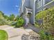 Charming home featuring a covered entryway and well-maintained landscaping, enhancing its curb appeal at 2007 S Balsam St, Lakewood, CO 80227