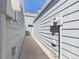 Side yard view showing the space between two houses, featuring the siding and utilities at 2007 S Balsam St, Lakewood, CO 80227