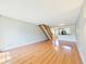 Spacious living room with hardwood floors, open layout, and staircase, creating a welcoming atmosphere at 2007 S Balsam St, Lakewood, CO 80227
