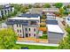 Aerial view of a modern three-story home with a private backyard and detached garage at 3205 Quivas St, Denver, CO 80211