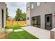 Private backyard with patio and grassy area at 3205 Quivas St, Denver, CO 80211